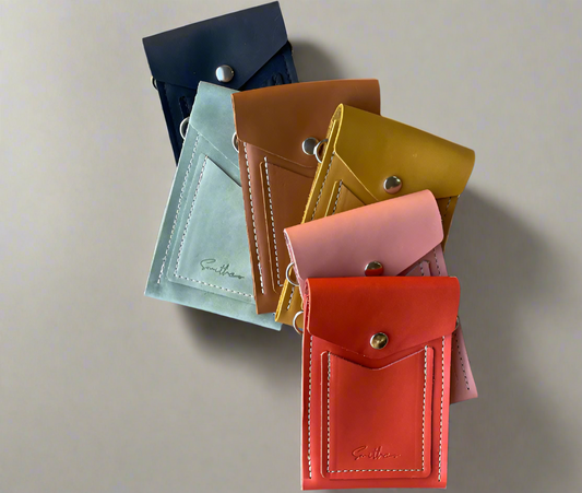 Collection of Compact phone-sized leather mini bag crafted from high-quality full-grain leather, featuring an adjustable crossbody strap. Ideal for carrying essentials like smartphones and cards while adding a pop of colour to your outfit.