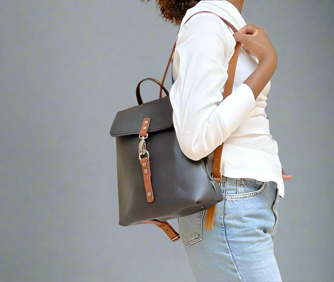 Model wearing the Smithco Leather black and tan backpack