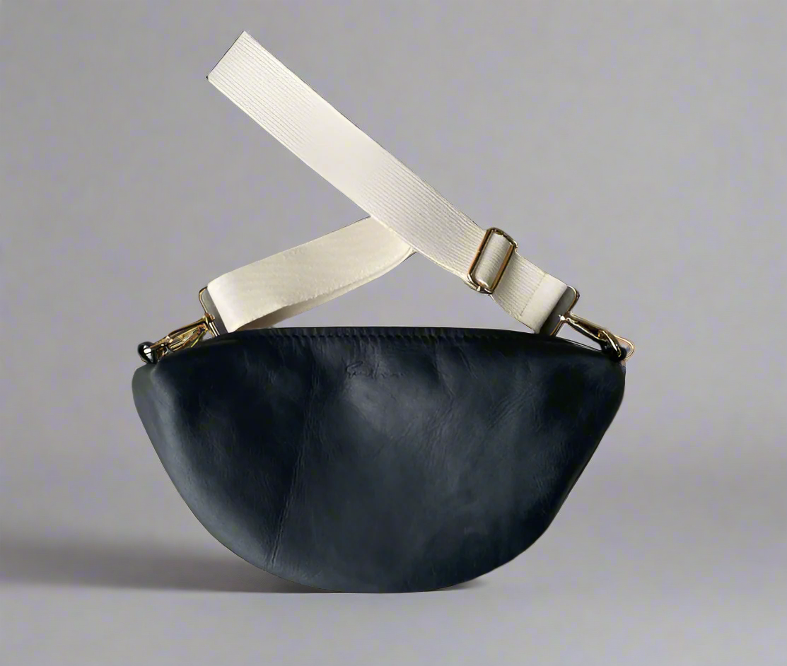 Halfmoon crossbody bag in full grain black leather with cotton webbing strap
