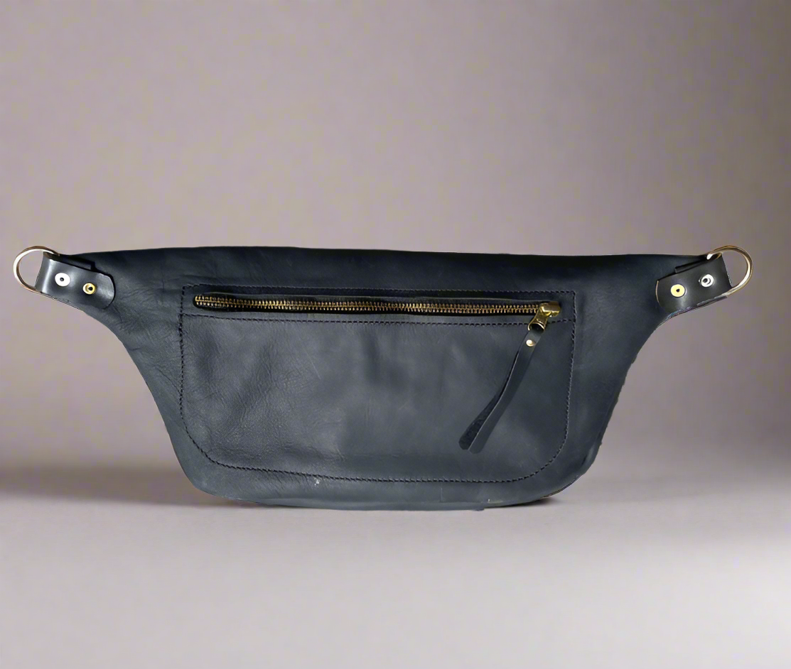 Back of black leather moonsling bag with large zipped pocket