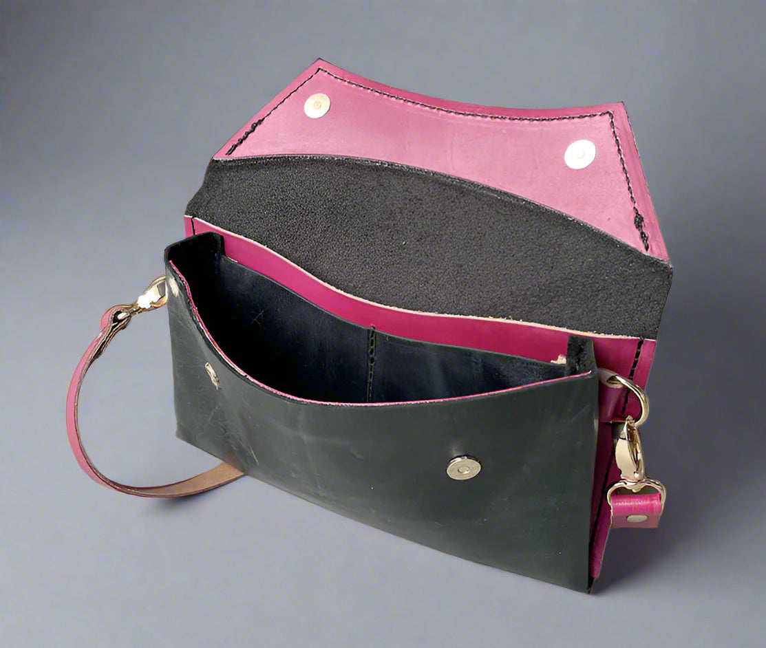 Handmade full-grain black & rose pink leather Crescent Clutch Bag inner with vibrant two-toned design – versatile clutch or crossbody with adjustable strap. Perfect for stylish women, features compartments for phone and cards.