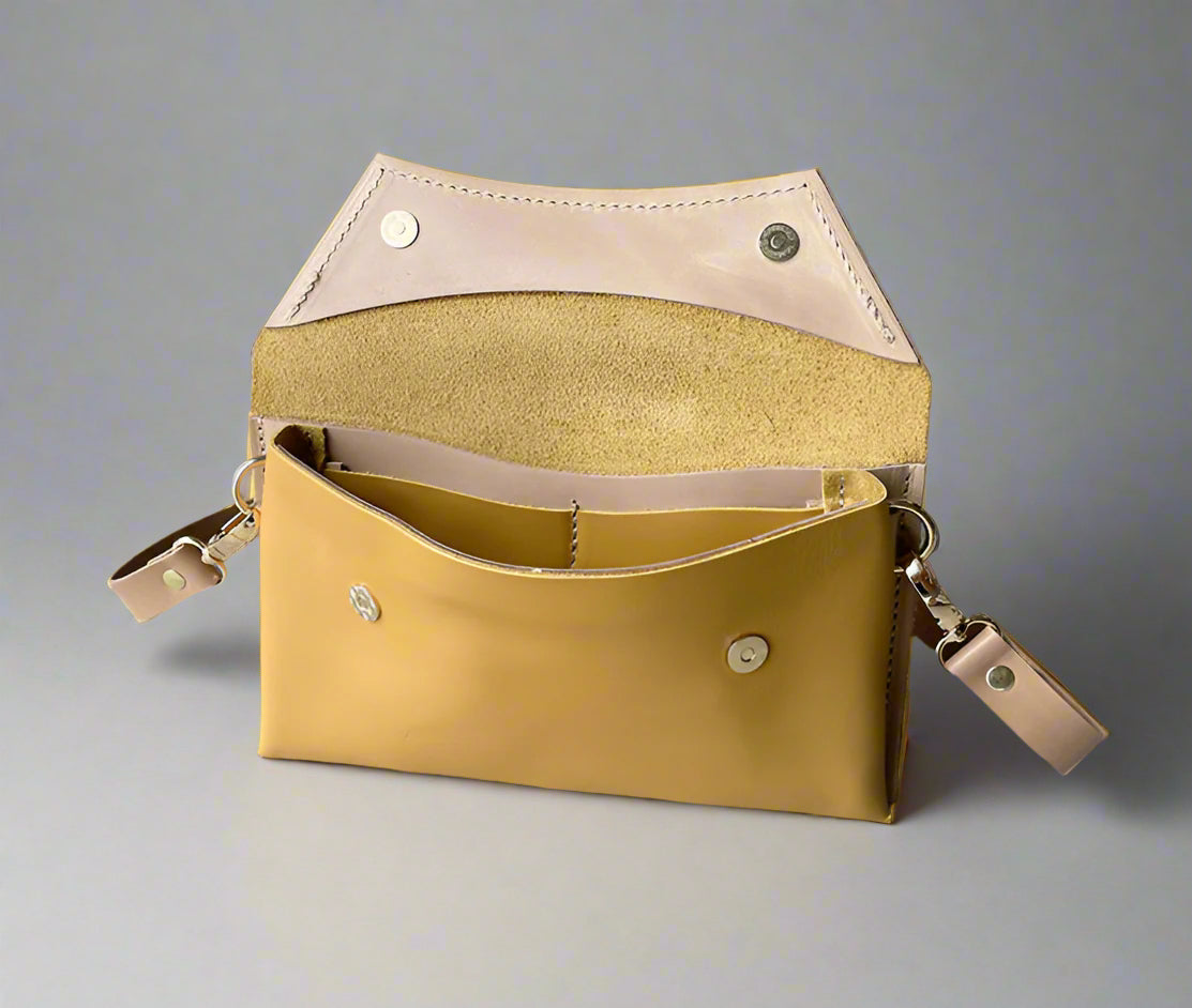 Handmade full-grain yellow leather Crescent Clutch Bag inner with muted two-toned design – versatile clutch or crossbody with adjustable strap. Perfect for stylish women, features compartments for phone and cards.