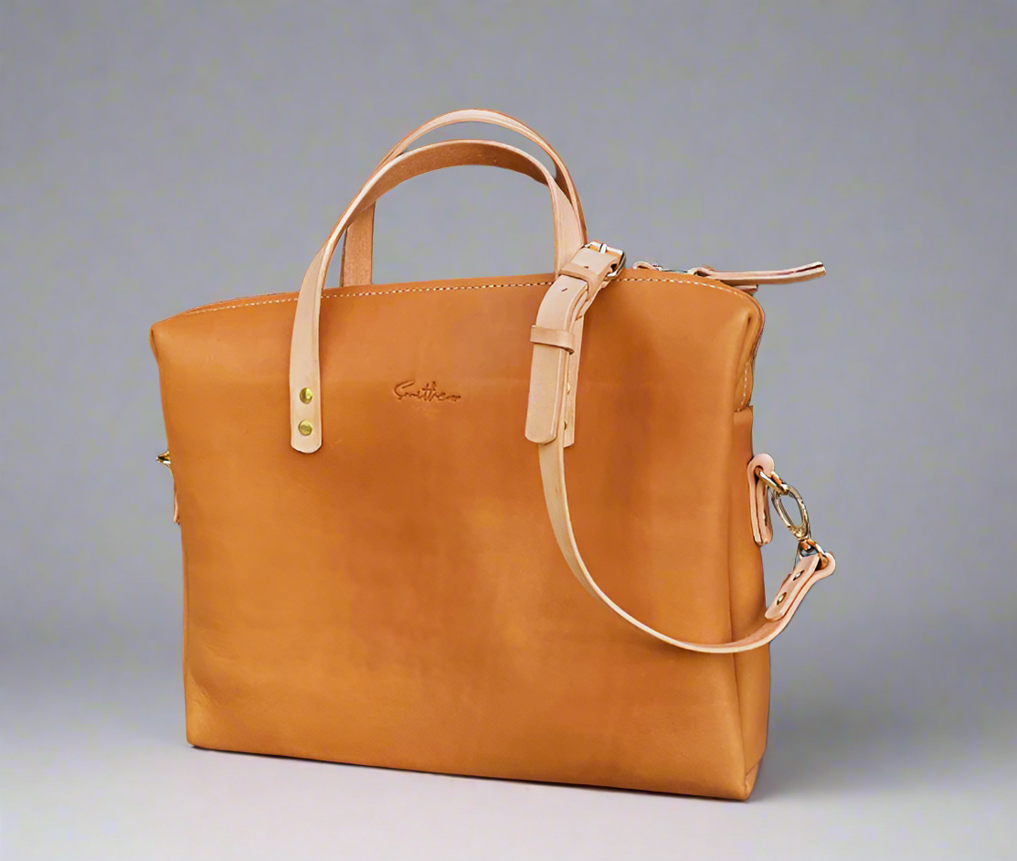 Compact tan coloured leather laptop bag with shoulder strap and zip closure – Cape Town craftsmanship
for professionals, handmade in Cape Town