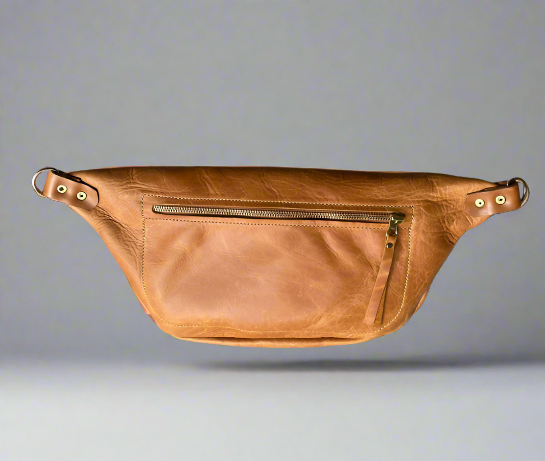Back of toffee colour leather moonsling bag with large zipped pocket