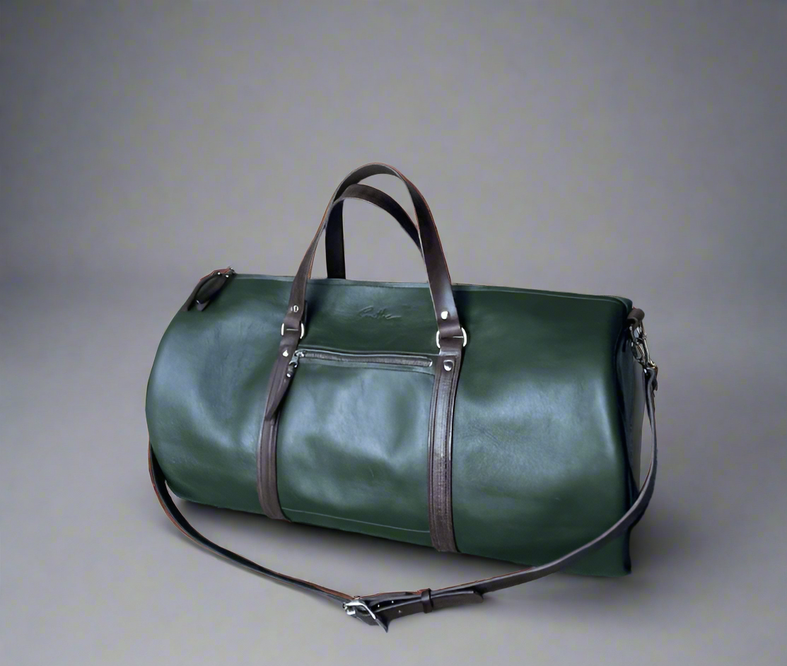 Spacious full grain leather weekend duffel bag in forest green with brown details, with sturdy handles and detachable strap, handmade in Cape Town