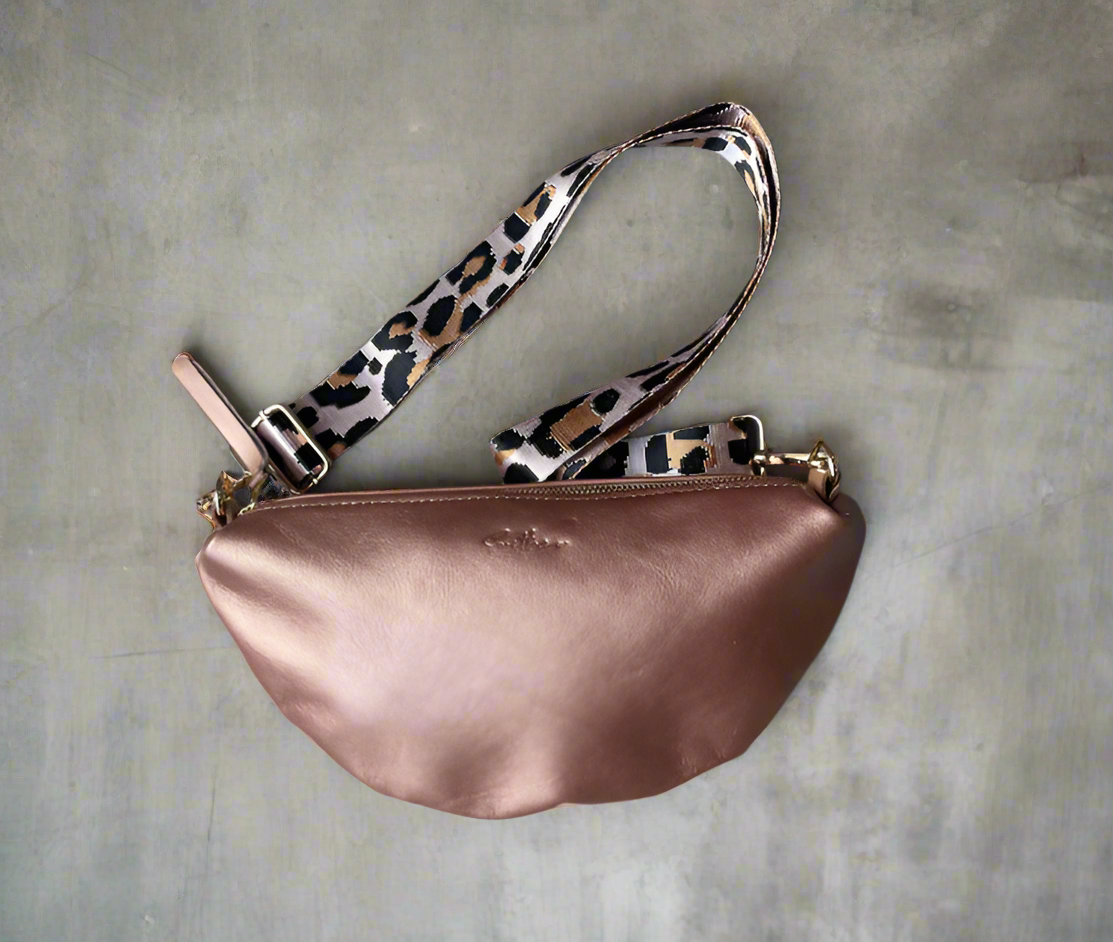 Halfmoon crossbody bag in full grain rose gold  leather with a leopard print strap