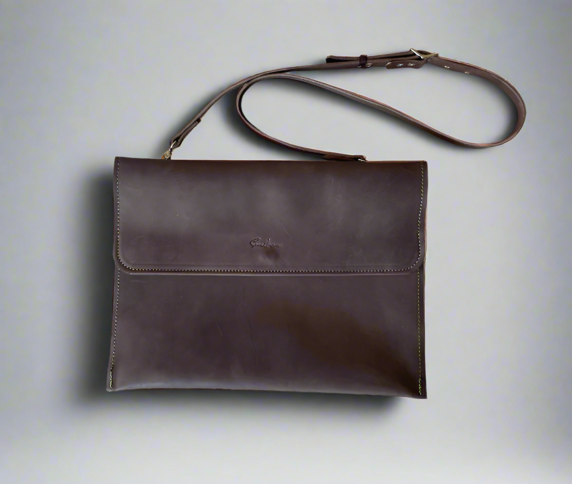 Brown laptop sleeve with adjustable strap