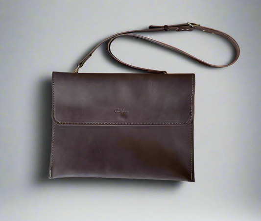 Brown laptop sleeve with adjustable strap