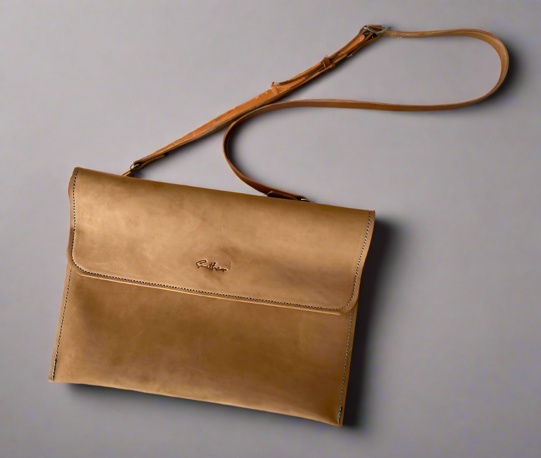 Tan leather laptop bag with adjustable strap