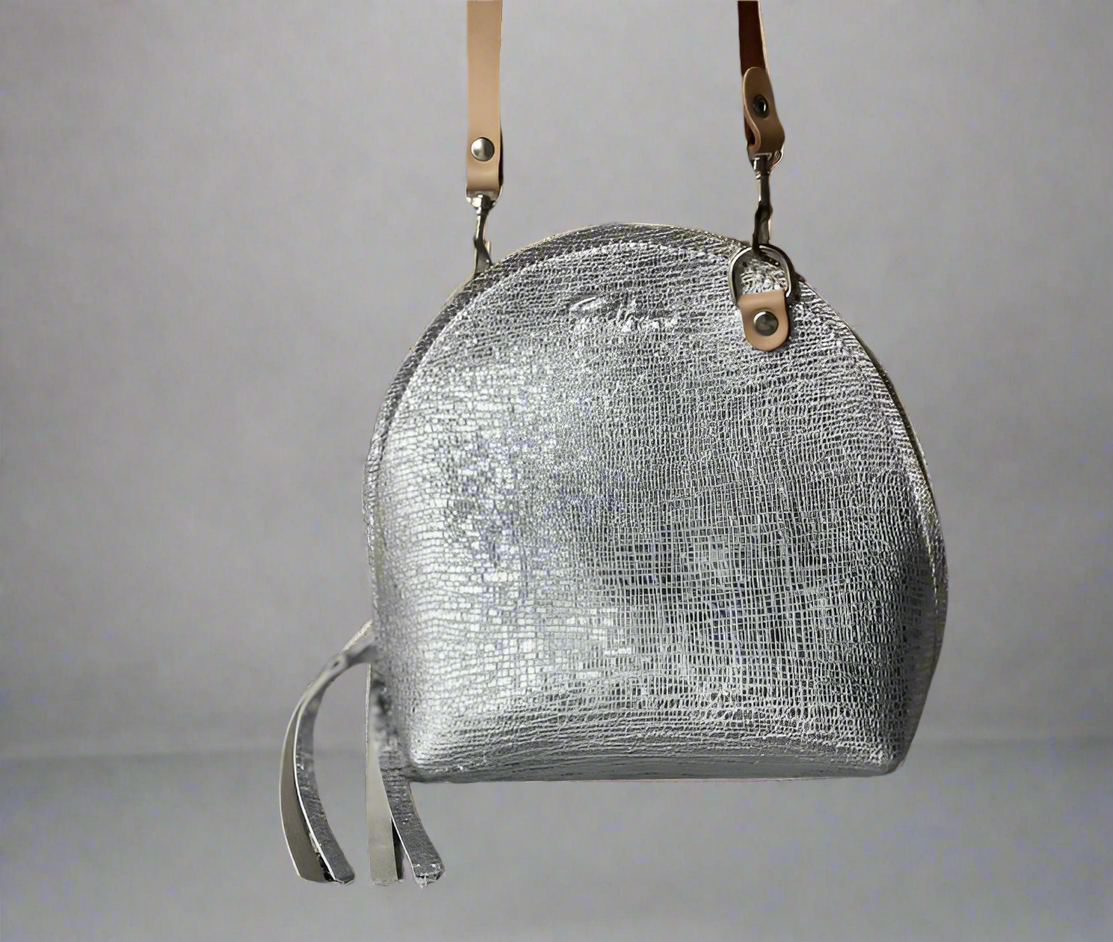 The Arc mini crossbody leather bag in textured silver