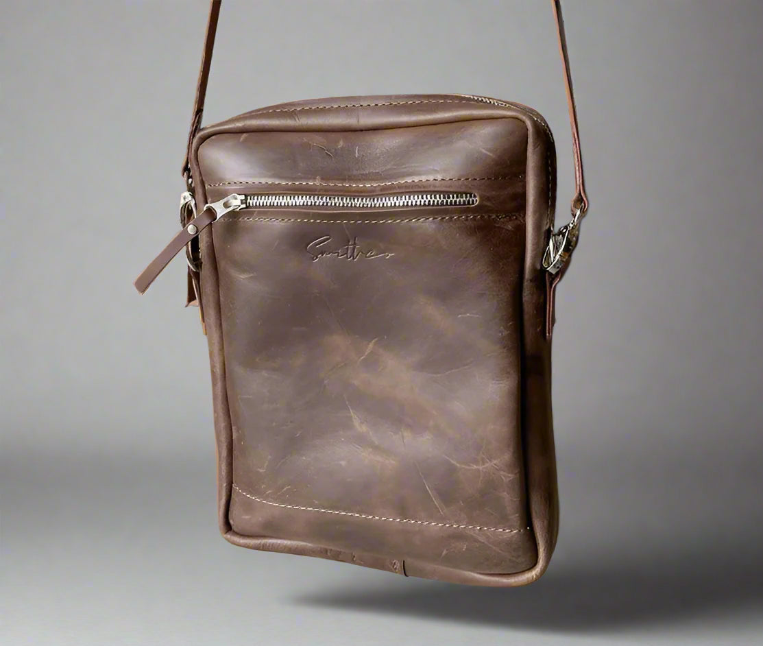 Unisex full grain brown leather crossbody sling bag with adjustable strap, handcrafted in Cape Town