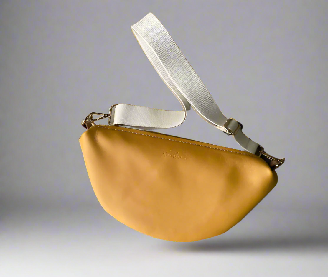 Halfmoon crossbody bag in full grain yellow leather with cotton webbing strap