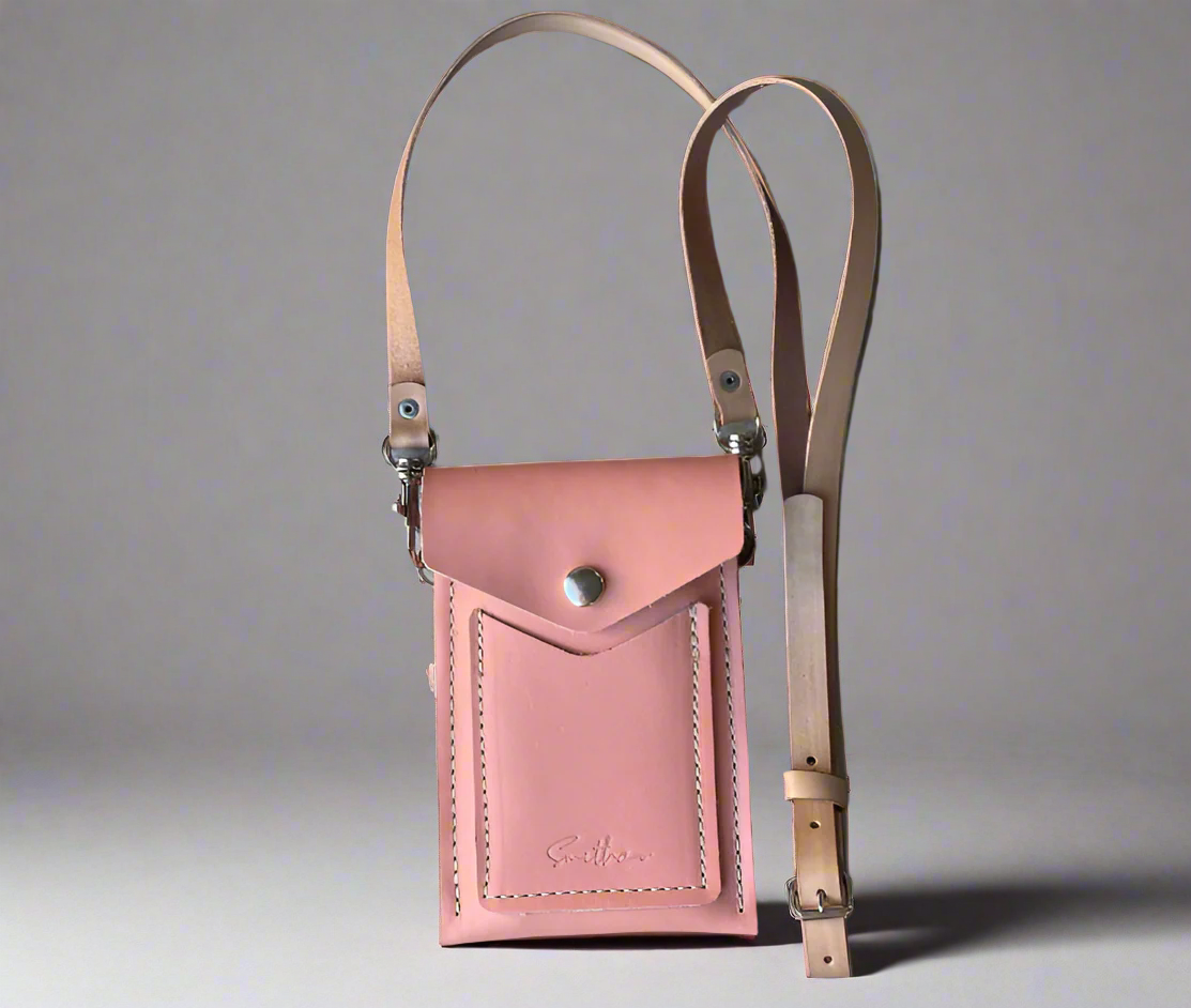 Essential Mini: a lightweight leather bag in rose pink designed for hands-free everyday wear