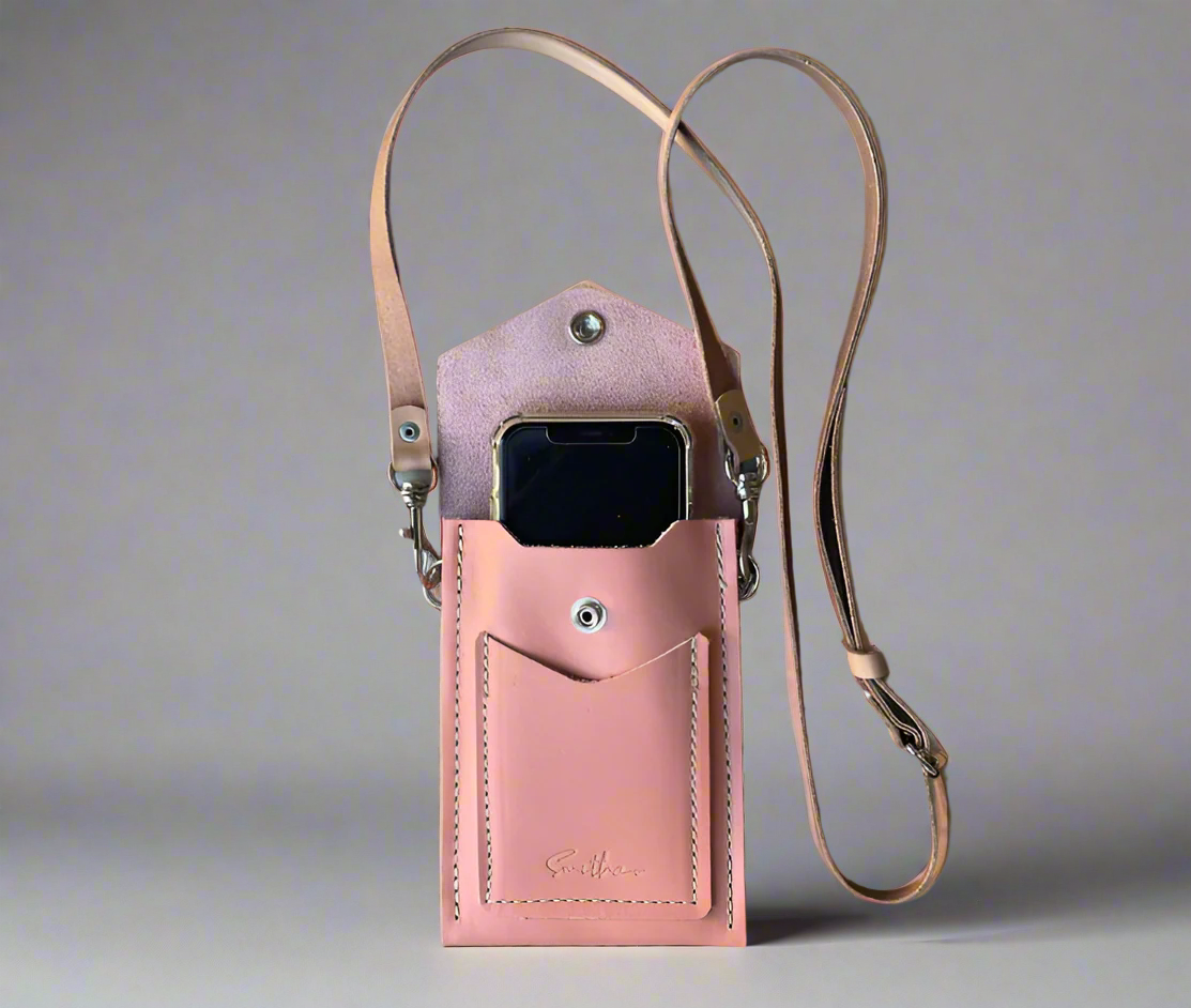 Smithco Leather Essential Mini Bag in rose pink with a phone for comparison – small structured leather bag for daily essentials.