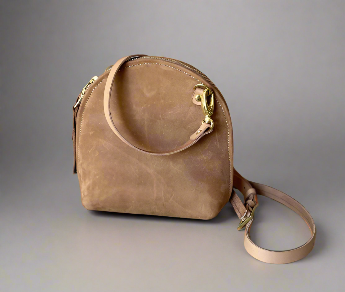 The Arc mini crossbody leather bag in suede choc