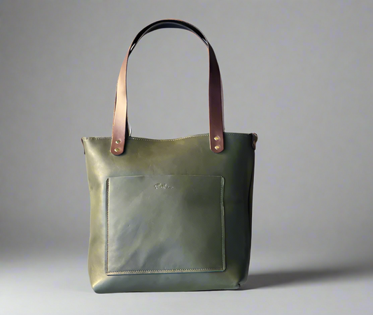 Handmade full grain leather shopper tote with structured shape and sturdy straps, crafted in Cape Town. Forest green and brown.