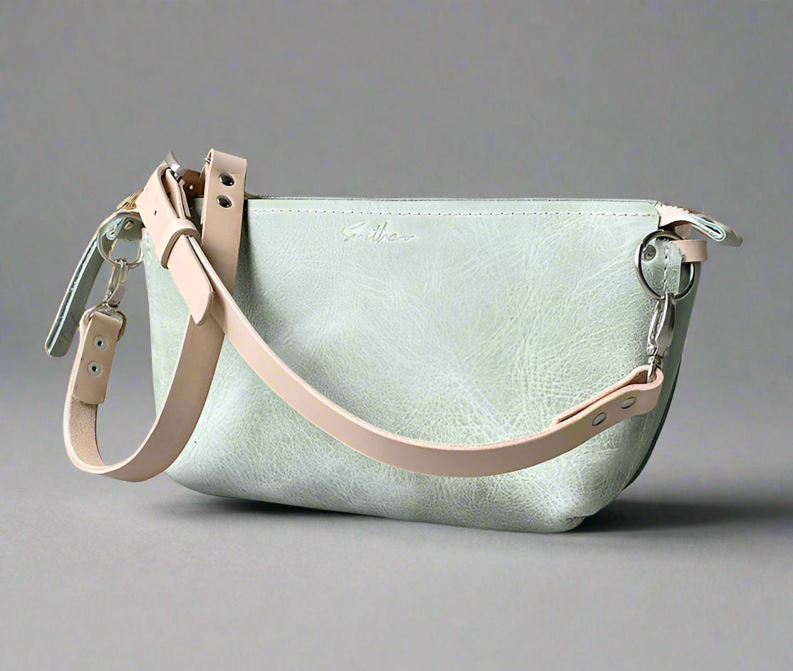 Medium-sized crossbody bag made from premium sage green & natural full-grain leather – Stylish and practical with adjustable strap for a perfect fit. Ideal for daily essentials, work, and city adventures.