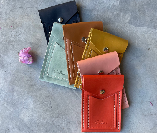 Collection of Compact phone-sized leather mini bag crafted from high-quality full-grain leather, featuring an adjustable crossbody strap. Ideal for carrying essentials like smartphones and cards while adding a pop of colour to your outfit.