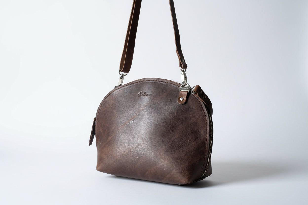 Brown full grain leather arced crossbody bag