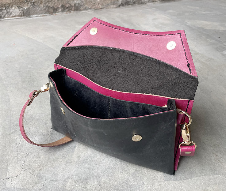 Handmade full-grain black & rose leather Crescent Clutch Bag inner with vibrant two-toned design – versatile clutch or crossbody with adjustable strap. Perfect for stylish women, features compartments for phone and cards.