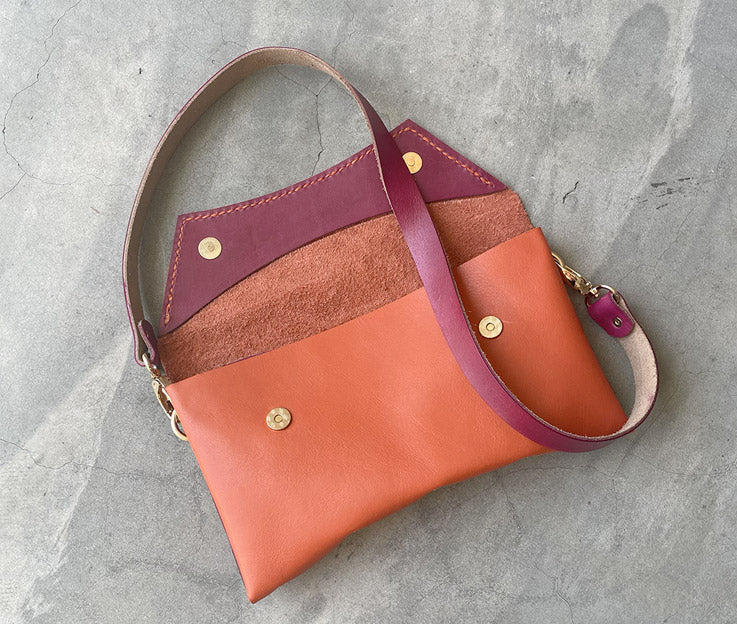 Handmade full-grain coral & rose leather Crescent Clutch Bag inner with vibrant two-toned design – versatile clutch or crossbody with adjustable strap. Perfect for stylish women, features compartments for phone and cards.