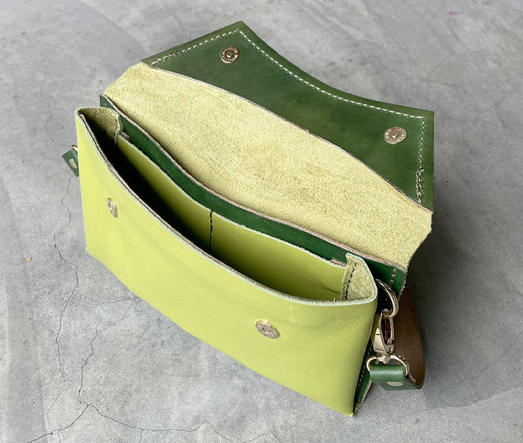 Handmade full-grain lime & forest greens leather Crescent Clutch Bag inner with vibrant two-toned design – versatile clutch or crossbody with adjustable strap. Perfect for stylish women, features compartments for phone and cards.