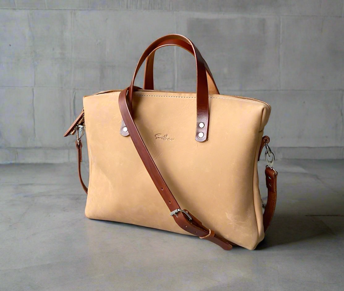 Compact full-grain suede feel fudge coloured leather laptop bag – Handmade, durable, and stylish. Perfect for professionals on the go, featuring a sleek design with ample storage. Women-owned business.