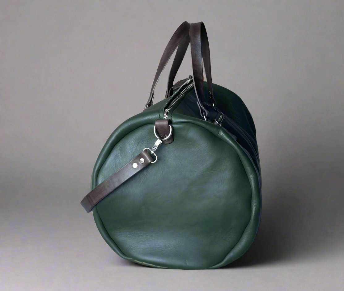 Spacious full grain leather weekend duffel bag in forest green with brown details showing the diameter with the detachable strap, handmade in Cape Town