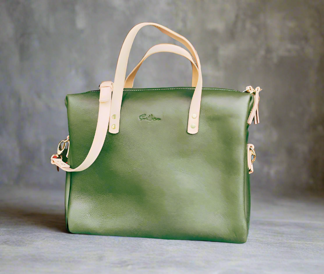 Compact full-grain forest green leather laptop bag – Handmade, durable, and stylish. Perfect for professionals on the go, featuring a sleek design with ample storage. Women-owned business.