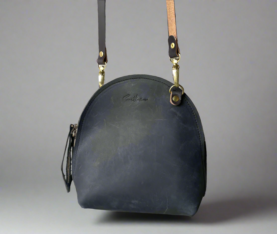 The Arc mini crossbody leather bag in black